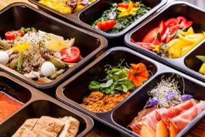 A bunch of food in containers on the table