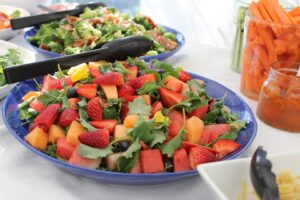 A plate of fruit salad on top of a table.